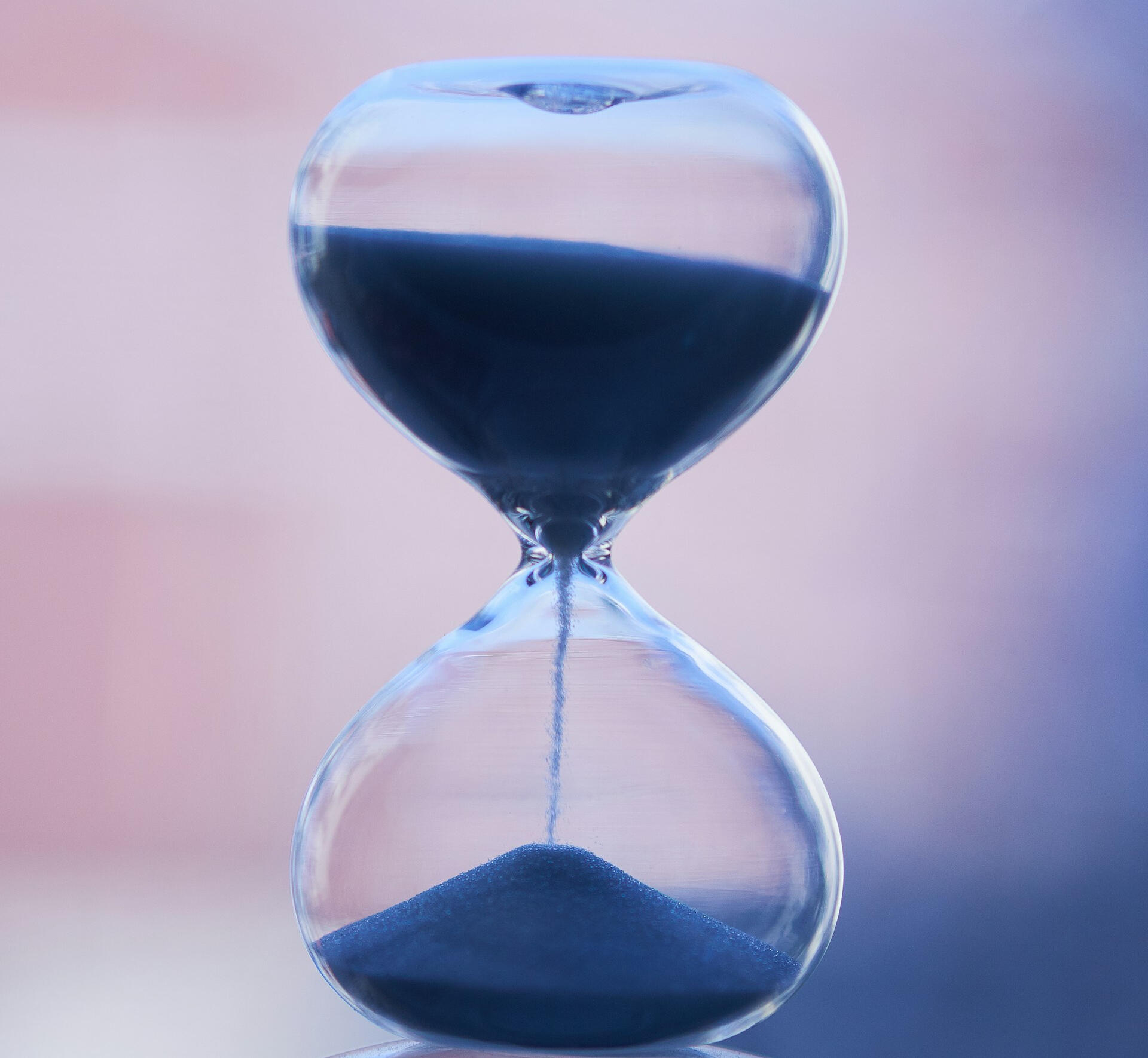 Hands typing on a laptop on a marble desk – focused work